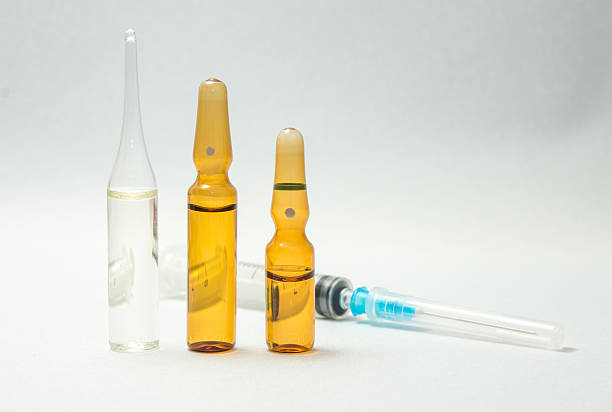 istock Syringe and group of ampules 516326078