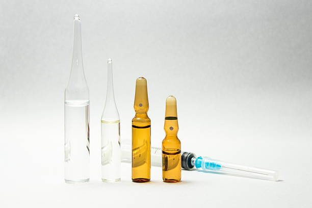 istock Syringe and group of ampules 516326226