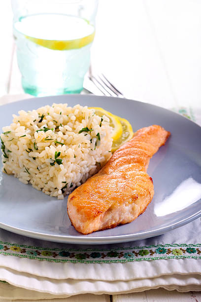 istock Fried piece of salmon and rice 516326890