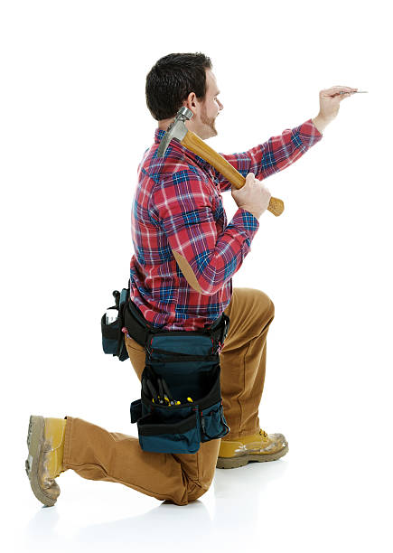 istock Rear view of carpenter working with hammer 516327888