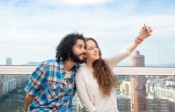 istock Young couple doing a selfie 516328720