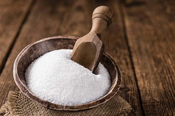 istock Portion of white Sugar in a bowl 516329090