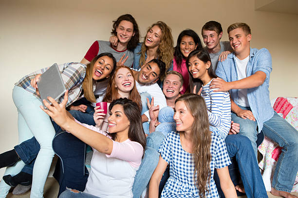 istock Group of Friends Taking Selfies 516332549