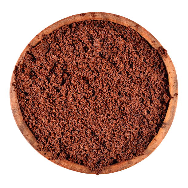 istock Ground coffee in a wooden bowl on a white 516332751