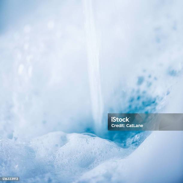 Water Running Into Bubble Bath Stock Photo - Download Image Now - Bubble Bath, Abstract, Blue