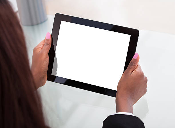 istock Businesswoman's Hands Holding Digital Tablet At Desk 516334689