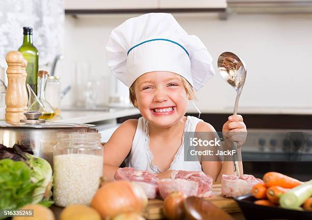 Baby Girl Cooking With Meat Stock Photo - Download Image Now - 4-5 Years, Assistance, Baby - Human Age