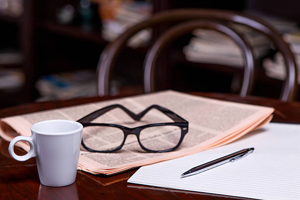 istock Cup of Coffee and Newspaper 516336047