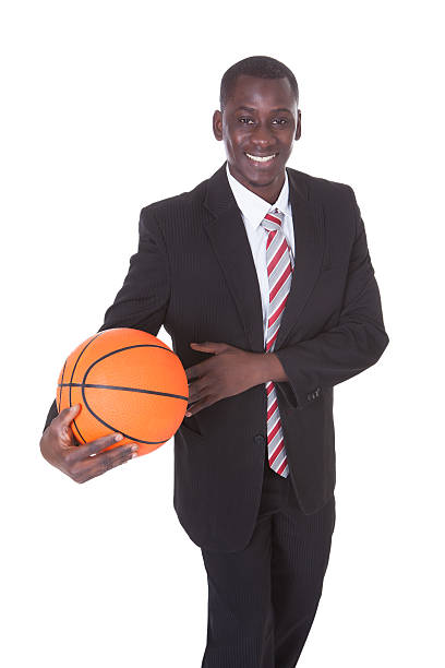istock Businessman Playing Basketball 516336159