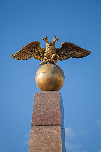 istock Golden Double Eagle monument, Russian coat of arms 516336491