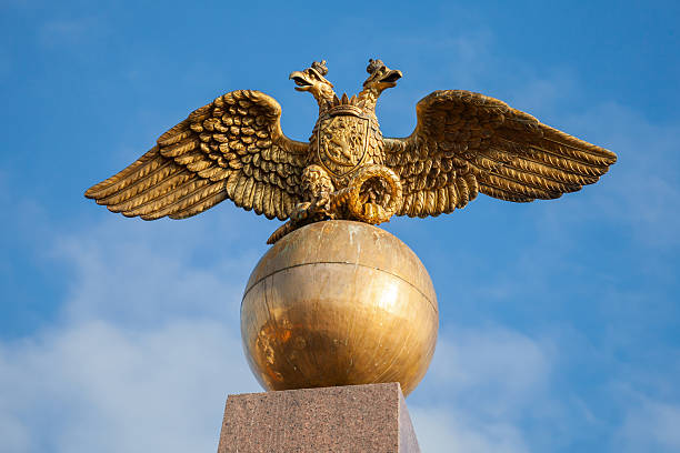 istock Golden Double Eagle seat on sphere, Russian coat of arms 516336499