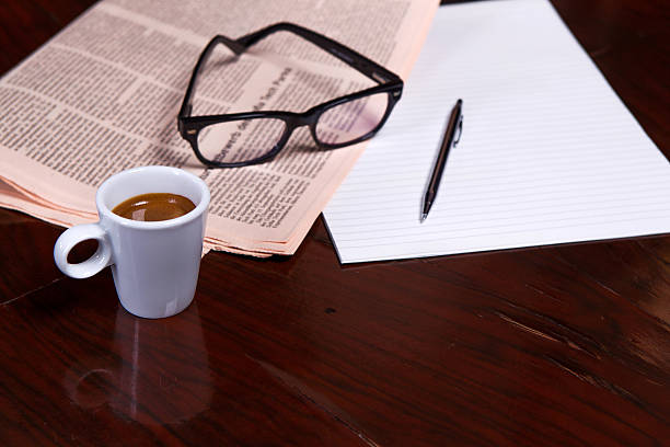 istock Cup of Coffee and Newspaper 516337541