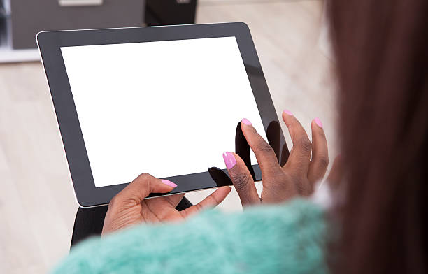 istock Woman Holding Digital Tablet At Home 516338435