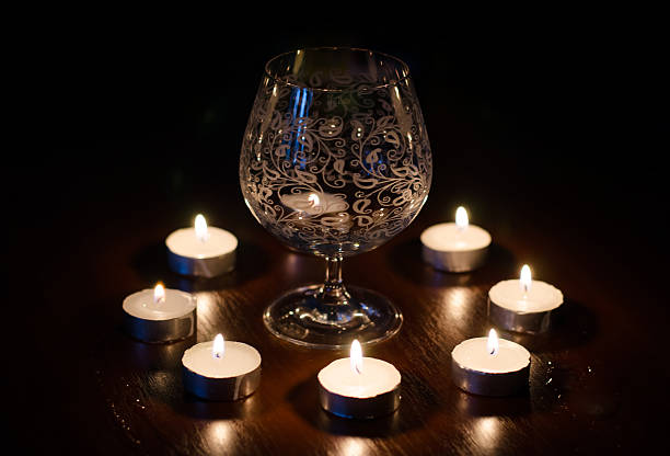 istock composition of the wine glasses and burning candles 516338639