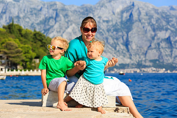istock mother with kids on sea vacation 516338771