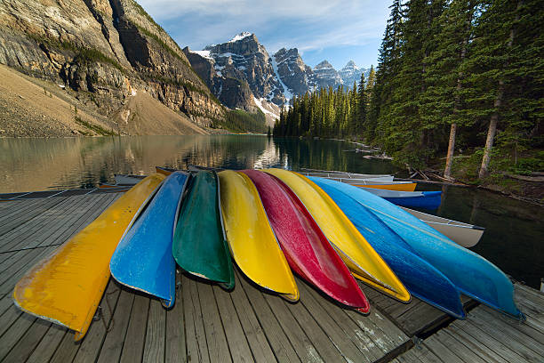 istock canoes by the mountain lake 516338781