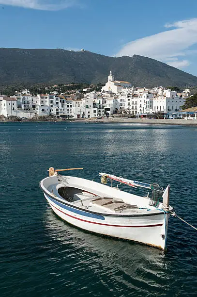 pano of cadaques with a small boat in a sunny day.