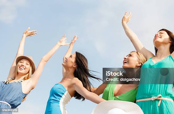 Smiling Girls With Hands Up On The Beach Stock Photo - Download Image Now - Beach, Friendship, Adult