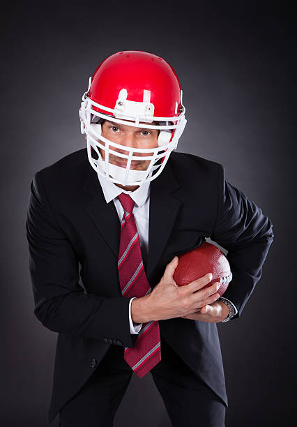 istock Businessman Holding Rugby Ball 516350335