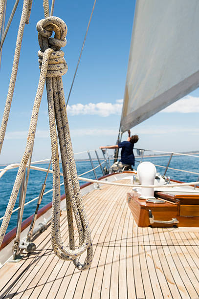 istock Man working on prow of yacht 516350945