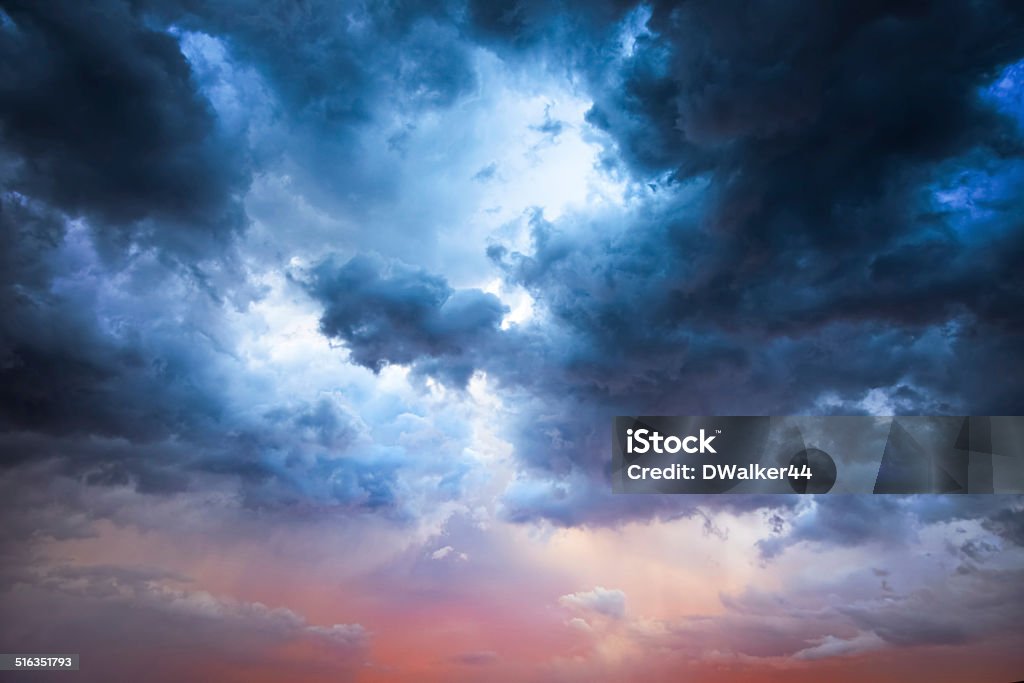 Majestic Storm Clouds Beautiful storm clouds on a summer night with pinks and blues. Sky Stock Photo
