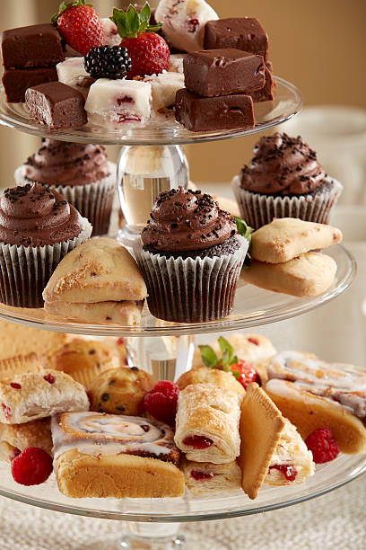 Three tier glass serving tray with mixed pastries