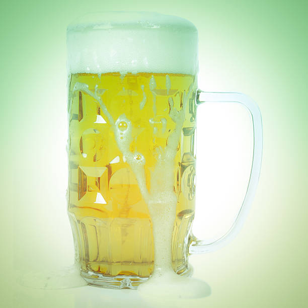 Retro look German beer glass Vintage looking Large German bierkrug beer mug tankard glass of Lager - isolated over white background large german beer steins stock pictures, royalty-free photos & images