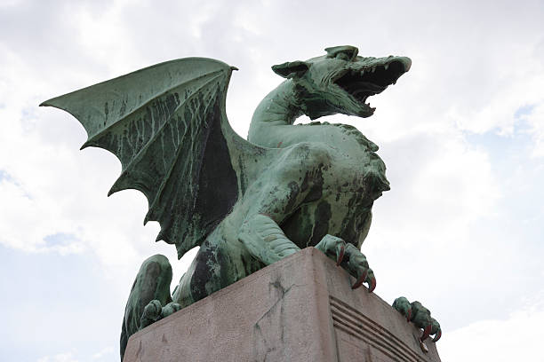 istock Low angle view of dragon bridge against sky 516353267