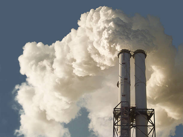 istock Dirty smoke stacks of a coal fired power plant 516353611