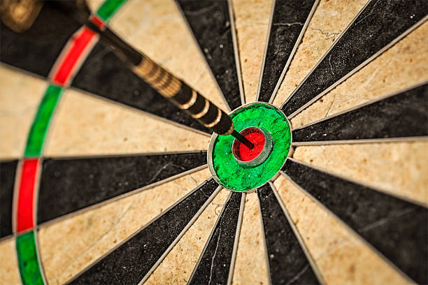 istock Dart in bull's eye close up 516354149