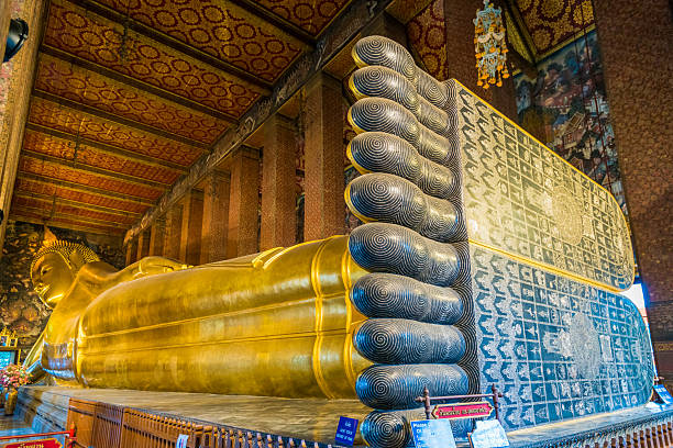 istock Reclining buddha with big Chakkra feet 516354217