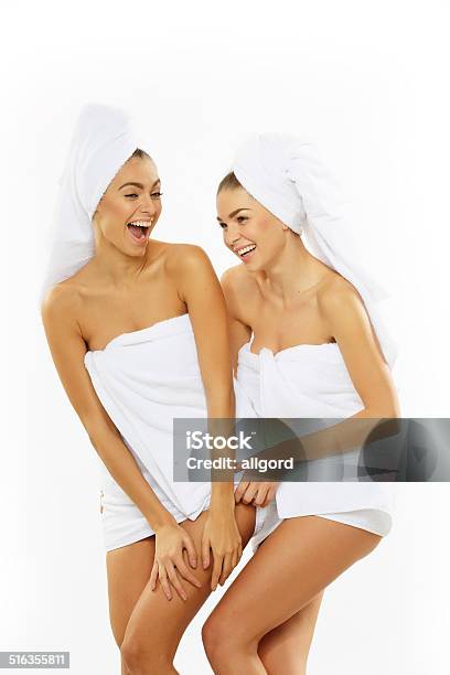 Two Happy Teenage Girls After Showering In Towels Stock Photo - Download Image Now - Adult, Applying, Bathroom
