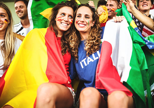 mixed national world supporter at the soccer stadium mixed national world supporter at the soccer stadium international match stock pictures, royalty-free photos & images