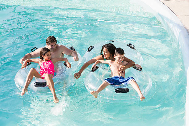 istock Family at water park 516356011