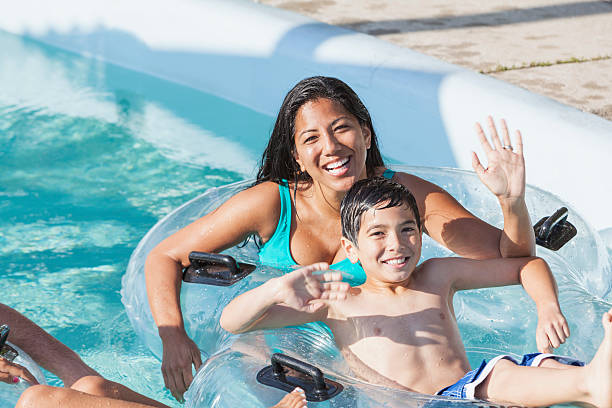 istock Mother and son at water park 516356019