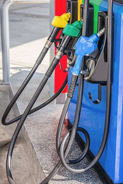 istock Gas pump nozzles in a service station 516357100