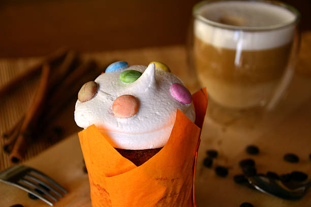 istock Homemade muffin with cup of coffee on a table. 516358178