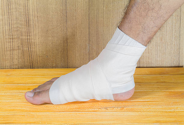istock male is wrapping with bandage. 516358276