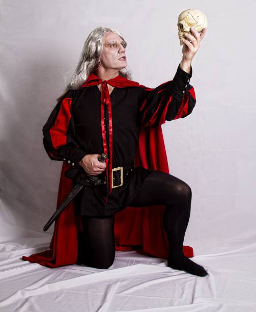Mature man acting out Hamlet role Mature man recreating the famous to be or not to be scene from Hamlet william shakespeare photos stock pictures, royalty-free photos & images