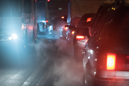 Exhaust fumes  in a traffic jam in nwinter night