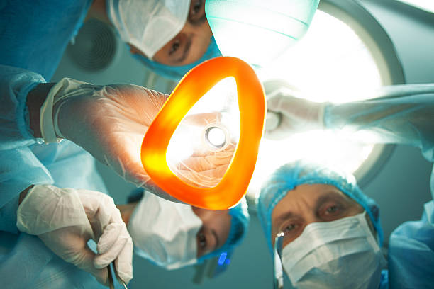 Skillful doctors are preparing person for operation stock photo