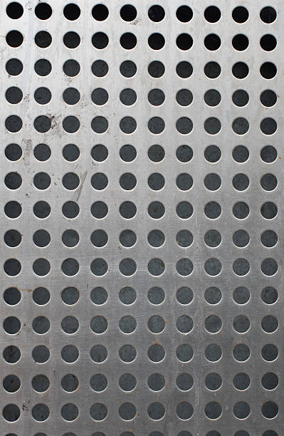 istock Metal background with holes 516363678