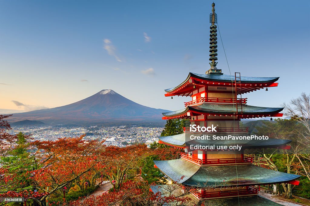 Mt. Fuji and Pagoda Fujiyoshida, Japan - October 30, 2015: Mt. Fuji viewed from  behind Chureito Pagoda in the autumn season. The pagoda dates from 1963. Autumn Stock Photo