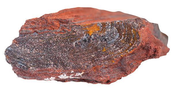 macro shooting of natural rock specimen - gemstone of ferruginous quartzite ( jaspillite, jaspilite, taconite, itabirite, hematite, iron ore) mineral isolated on white background