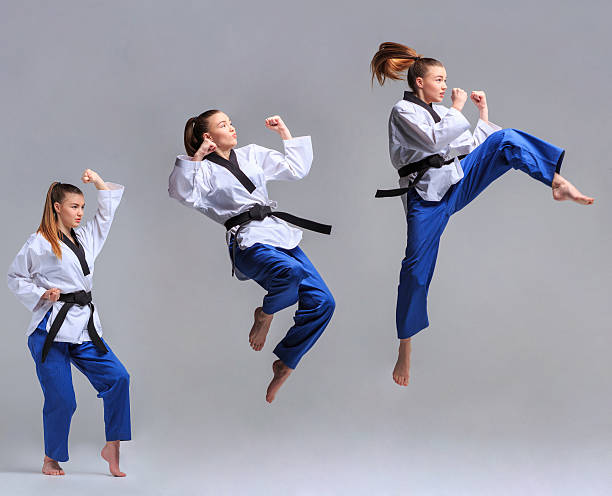 The collage of karate girl with black belt The collage of karate girl in white kimono and black belt training karate over gray background. taekwondo sparring stock pictures, royalty-free photos & images