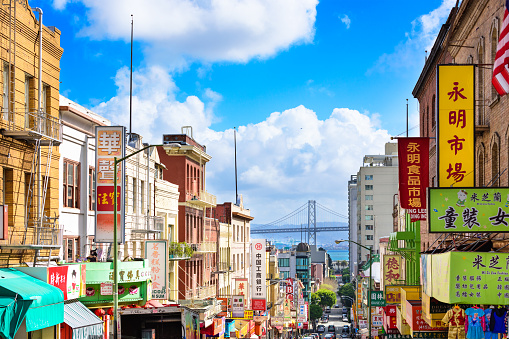 San Francisco, CA, USA - March 6, 2016: Traffic in the Chinatown district of San Francisco towards the Bay Bridge. It is considered the oldest Chinatown in North America with a history stretching back to 1848.