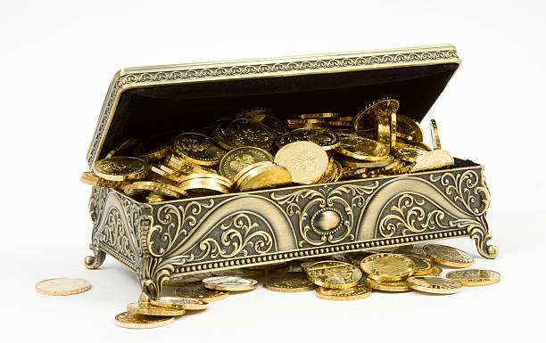 istock gold casket and gold coins on a white background 516372195