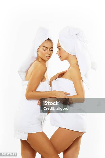 Two Happy Teenage Girls After Showering In Towels Stock Photo - Download Image Now - Adult, Applying, Bathroom