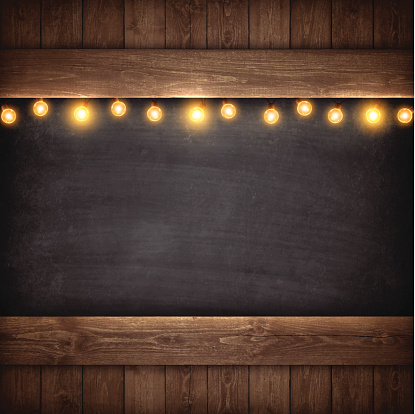 Christmas Lights on Wooden Boards and Chalkboard.
