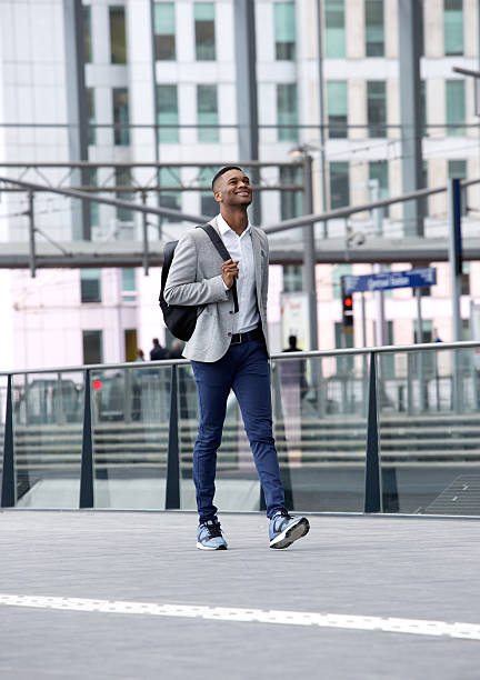 istock Young man smiling with bag at station 516374757